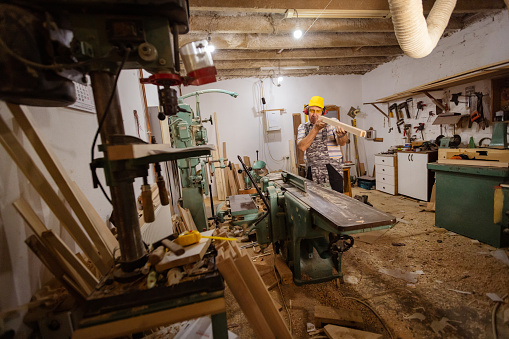 Sanding and preparing timbers for further crafting in the workshop