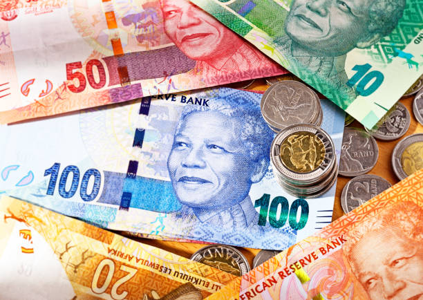 Varied new South African Mandela banknotes with coins The range of new South African banknotes, featuring the smiling face of iconic statesman Nelson Mandela, with Five Rand and Two Rand coins.  kudu stock pictures, royalty-free photos & images