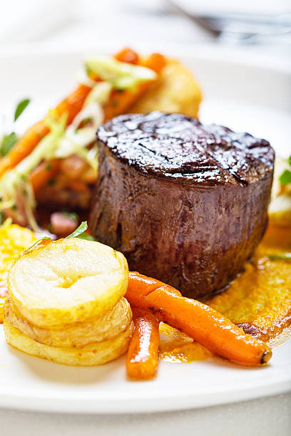 istock High-angle view of restaurant style steak and vegetables 168637865