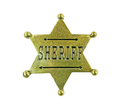 An old six star brass sheriff badge with  a clipping path.