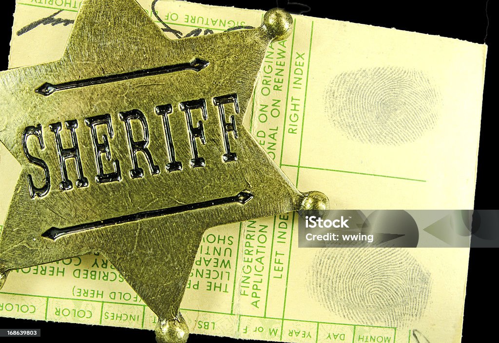 真鍮保安官バッジや指紋 - 書類のロイヤリティフリーストックフォト
