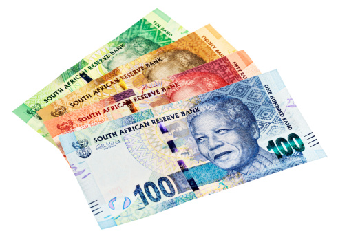 A sheaf of the new South African banknotes, including Ten, Twenty, Fifty and One Hundred Rand denominations, all  featuring the iconic statesman Nelson Mandela. Isolated on white. 