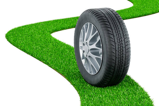 Car wheel on green grass way, 3D rendering isolated on white background