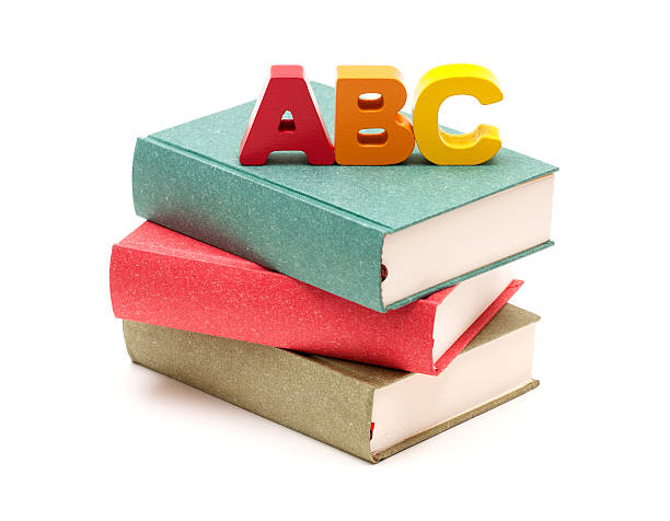 School Books and Alphabet isolated on white background