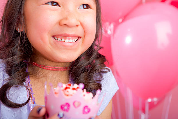 istock Young girl holding a cupcake 168641994