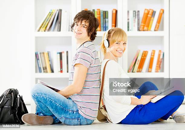 Students In A Library Stock Photo - Download Image Now - 16-17 Years, 20-29 Years, Activity
