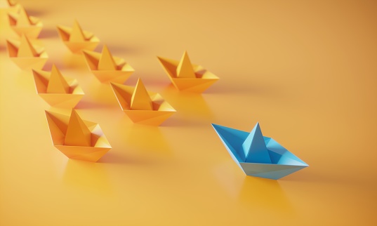 Orange colored paper boats and blue colored one in the first place, can be used leadership/individuality concepts. (3d render)