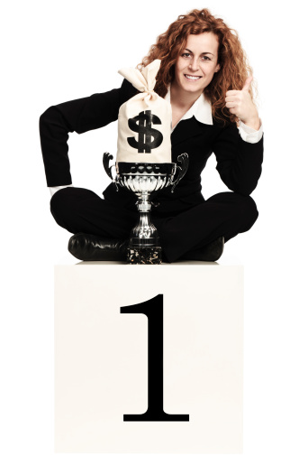 successful businesswoman with money bag and trophy