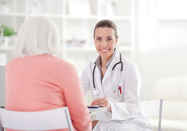 istock Senior woman with doctor. 168644970