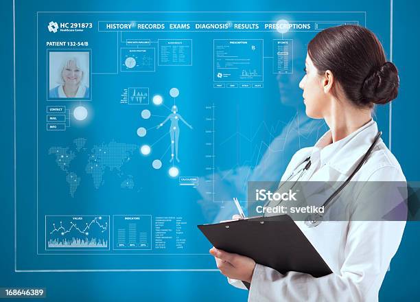 Female Doctor Working On Transparent Monitor Stock Photo - Download Image Now - Healthcare And Medicine, Intelligence, Computer Monitor
