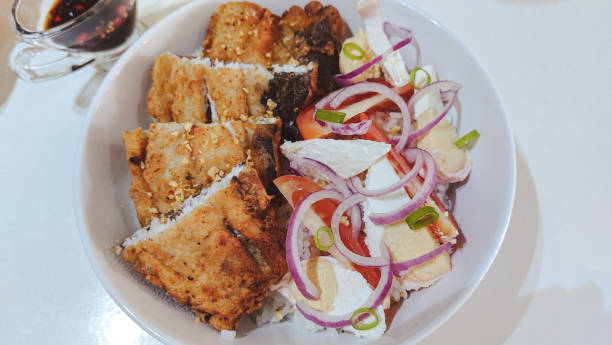 istock Fried bangus and salted duck egg salad 1686472556