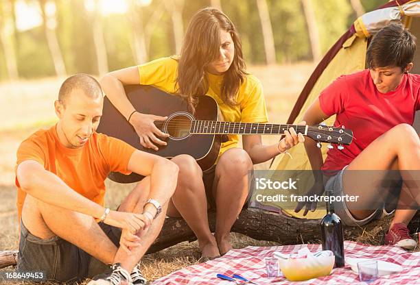 Friends On A Picnic Camping Day Stock Photo - Download Image Now - 20-29 Years, Adolescence, Adult