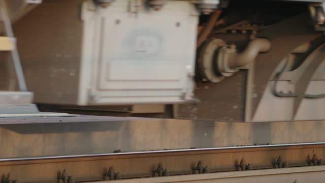 Video 4k. Train departure. Close-up view of wheels and rail. Train passes on rails. Bottom view