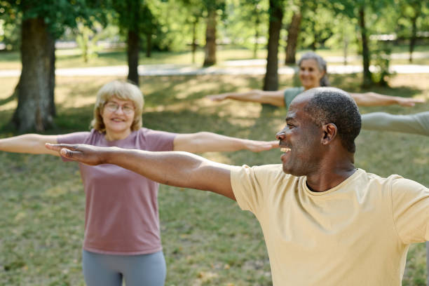istock Senior people exercising together in the park 1686536659