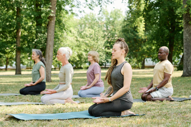 istock Coach meditating together with senior people 1686542420