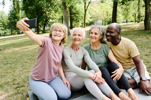 istock Elderly people making selfie portrait in the park 1686543479
