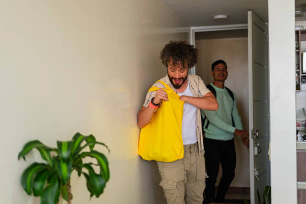 istock A gay couple chats while walking down the stairs and enjoying a conversation 1686557762
