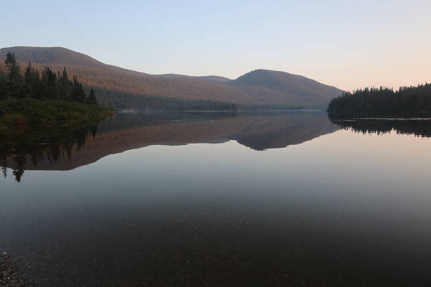 Cascapedia lake in Quebec is a remote lake in the Chic-Choc mountains.  It offers very nice landscapes such as this one offering symmetry in nature.