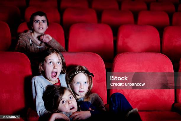 Watching A Scary Movie Stock Photo - Download Image Now - Horror Movie, Child, Movie Theater