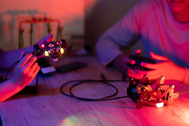 istock Young man and young woman amateur inventor testing electronic device 1686582992