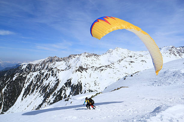 istock Tandem paraglider starts to fly 168658378