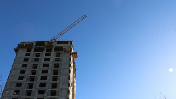 istock residential building under construction with a high-rise crane against a clear sky 1686594903