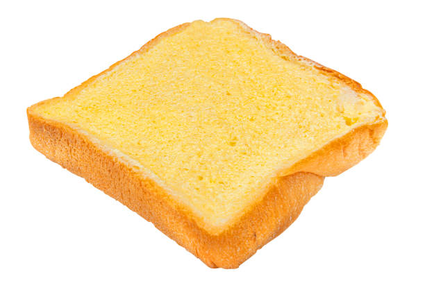 Slice of Bread with Butter Spread Isolated on White Background.