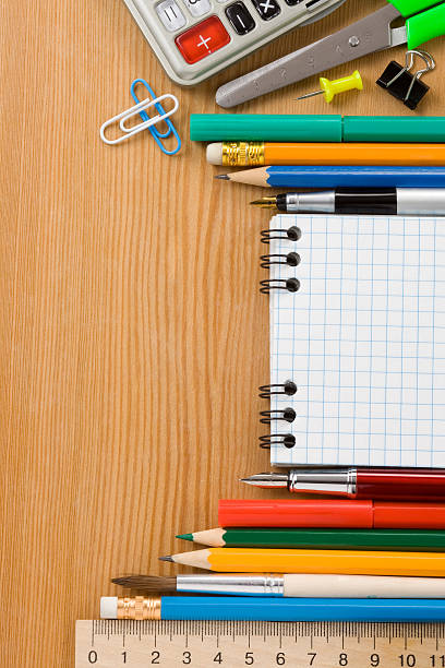 istock school supplies and checked notebook on wood 168660737