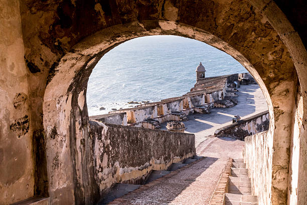 El Morro Fortress, Puerto Rico Staircase with view to a gun tower and ocean at the El Morro Fortress in Old San Juan, Puerto Rico puerto rico photos stock pictures, royalty-free photos & images