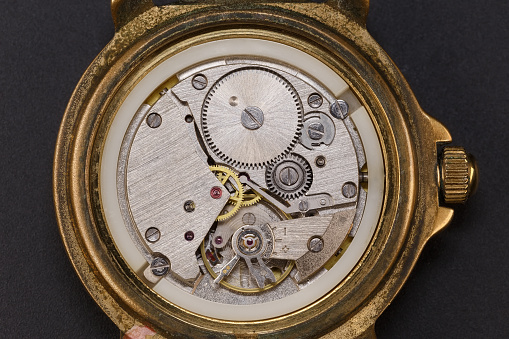 Clock mechanism of an old wristwatch. Macro photography