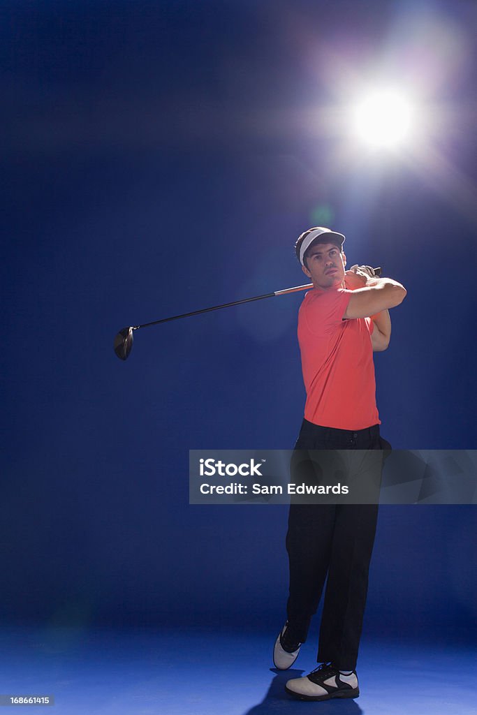 Golf-Spieler, schwingende club - Lizenzfrei Blau Stock-Foto