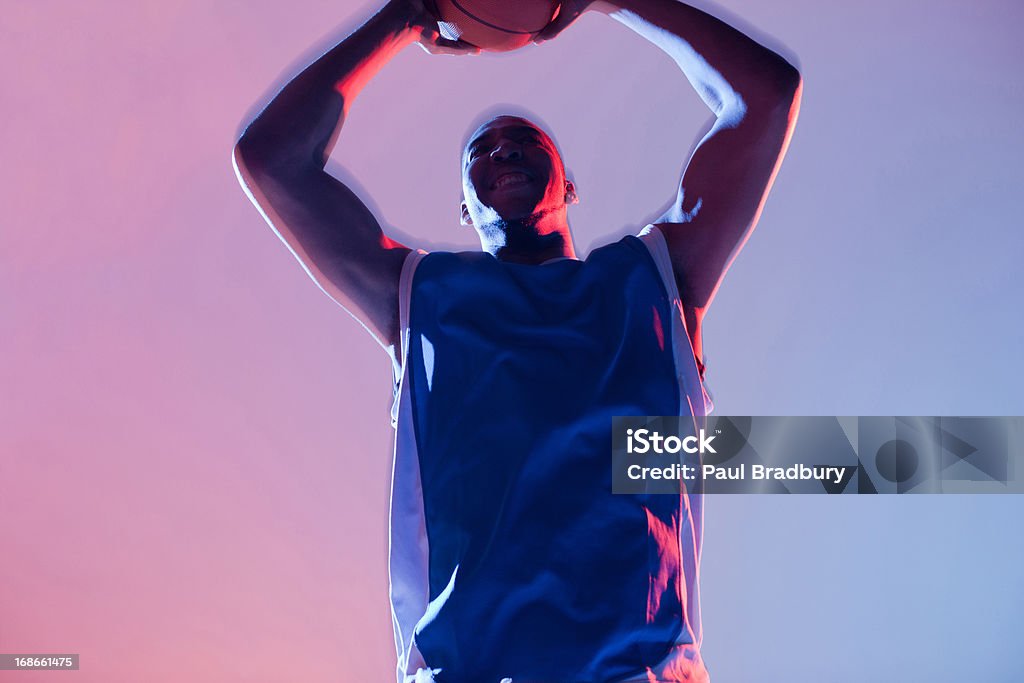 Basketball player holding ball  Basketball - Sport Stock Photo