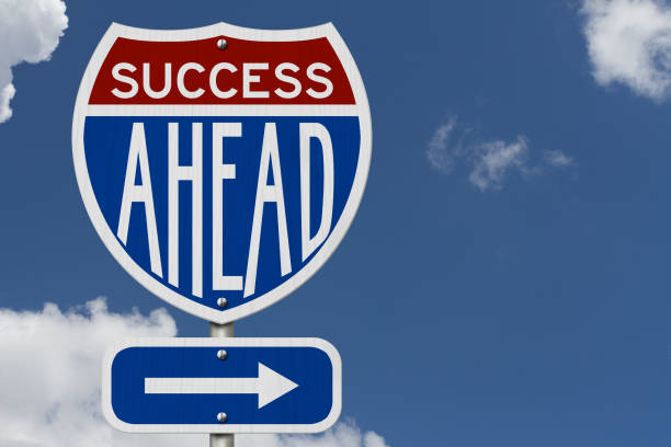 istock Success Ahead message on highway road sign 1686625887
