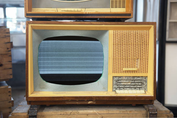 istock An old TV with noise on the screen sits on a box. 1686646014