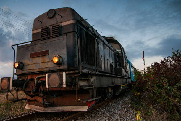 istock Diesel-Electric Romanian Train on the Railroad at sunset 1686652832