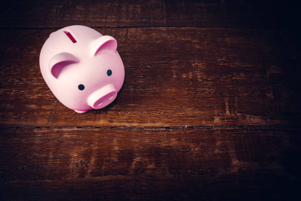 istock Piggy bank on wooden table 1686676245