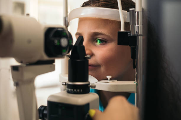 istock examination of a child with a slit lamp, microscope and focused light source. device for high-precision examination of the eye to determine the condition of the lens, the cornea. equipping the ophthalmologist's office. 1686689265