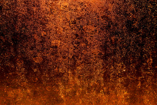 Black dark orange red brown shiny glitter abstract background with space. Twinkling glow stars effect. Like outer space, night sky, universe. Rusty, rough surface, grain.