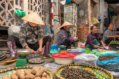 Saigon, Vietnam - September 22, 2013: Life of Vietnamese vendors at small market in Ho Chi Minh city (Saigon), Vietnam.