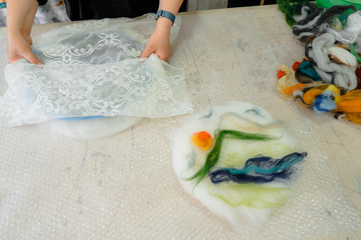 Close up process of making crafts from felt