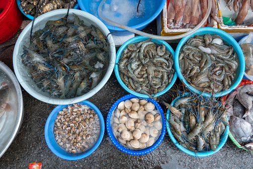 Close-up of shellfish, fish, shrimp etcetera at the fish market. This photo was taken in Hanoi, Vietnam