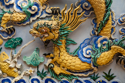 Colourful dragon in a temple in Hanoi, Vietnam. Stone