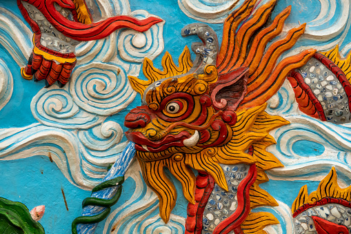 Colourful dragon in a temple in Hanoi, Vietnam. Stone