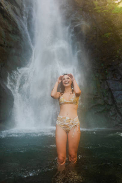istock Woman swimming in waterfall 1686721133