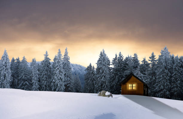 istock Christmas hut with lighted window in a snowy winter landscape 1686727583