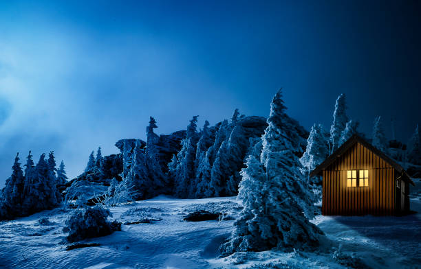 istock Christmas hut with lighted window in a snowy winter landscape 1686728656