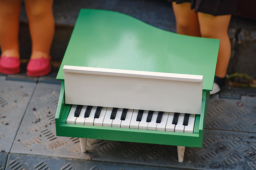 Small toy piano of the USSR era. The concept of music and entertainment.