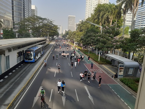 Jakarta, Indonesia, September 17, 2023: Sunday is car free day, people are free to exercise even though it is sunburned, by running, cycling, jogging or taking a leisurely walk, having fun together.