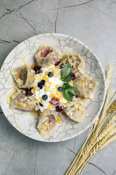 istock Ukrainian cuisine. Delicious dumplings with sour cream 1686751642