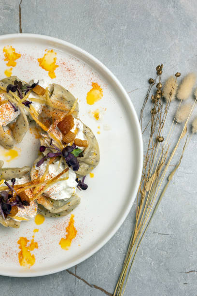 istock Ukrainian cuisine. Delicious dumplings with sour cream 1686752173
